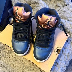 Youth grade school Jordan’s navy blue and rose gold